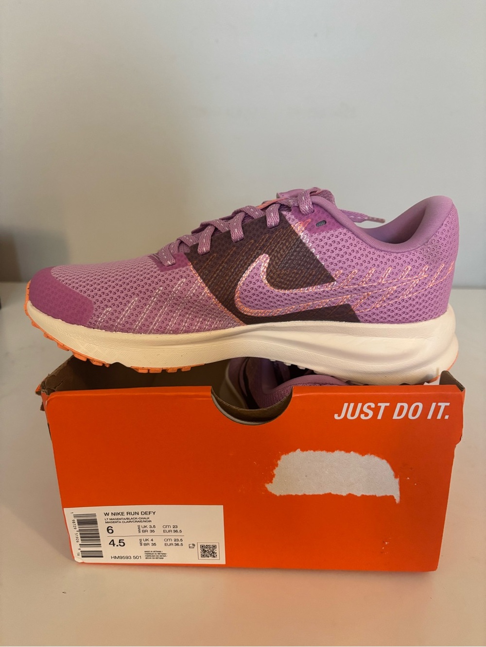 Nike Women's Purple and Pink Run Defy Trainer